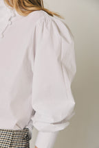 Chemise unie avec boutons recouverts blanc